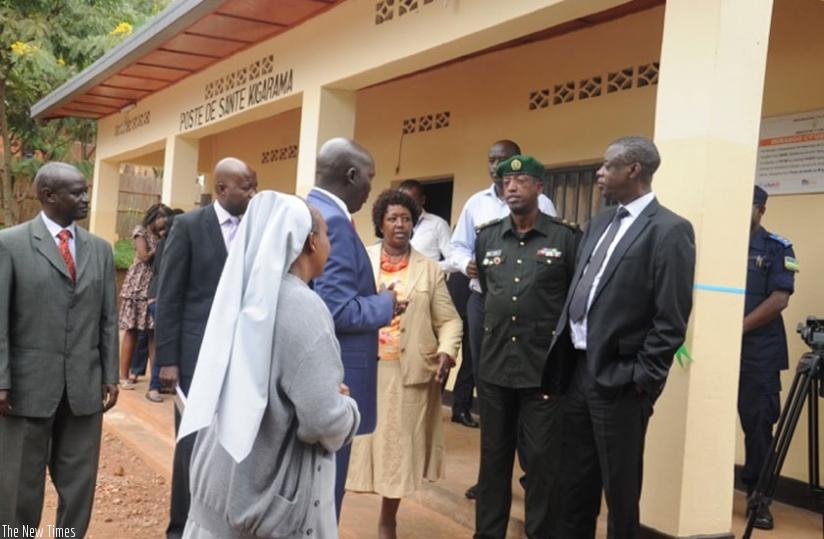 Dr. Binagwaho (C), Kabarebe (R) and other officials after the inauguration of Kigarama health post in Kicukiro District yesterday. (Ivan Ngoboka)