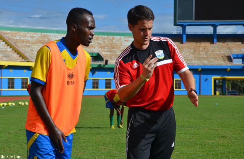 Amavubi coach Johnny McKinstry gives AS Kigali defender Janvier Mutijima instructions during training recently. Amavubi need just a draw to qualify for the next round. (Sam Ngendahimana)