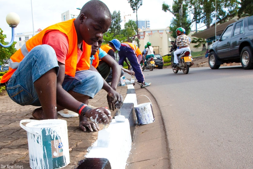 Painters have been urged to embrace standards to enhance competitiveness in the industry. (T. Kisambira)