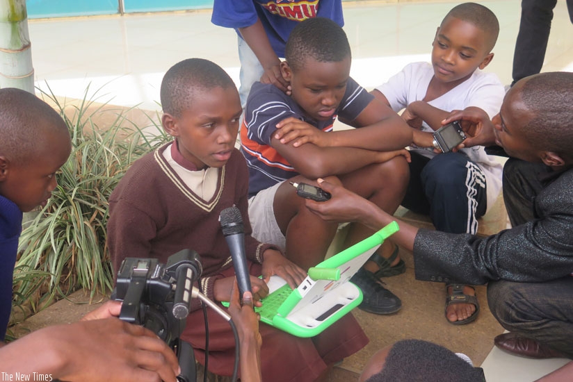 Hirwa Aldo from GS Kicukiro explains his project at  an interactive question and answer quiz. (Moses Opobo)