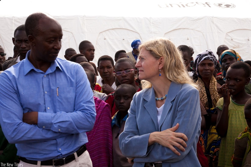 Midimar Parmanent Secretary, Antoine Ruvebana, and US ambassador, Erica Barks-Ruggles, during their visit to Mahama Camp on Friday. (Faustin Niyigena)