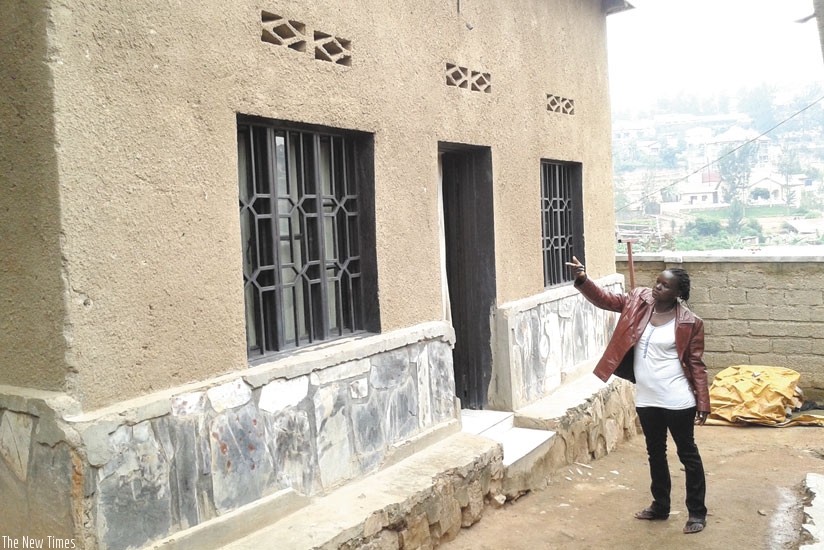 Mukahirwa points at one of her houses which she rents out in Gishushu. (Peterson Tumwebaze)