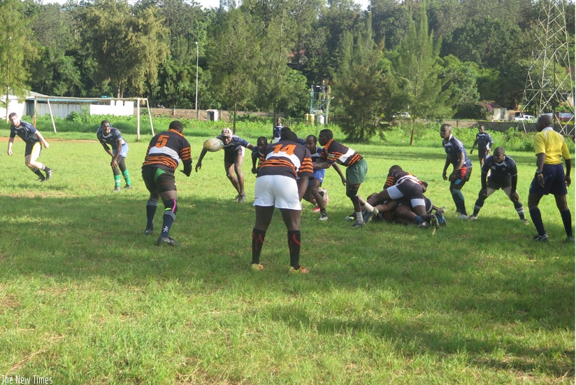 Remera Buffaloes (in striped jersey) won this year's rugby title after defeating Thousand Hills 17-10. (Stephen Kalimba)
