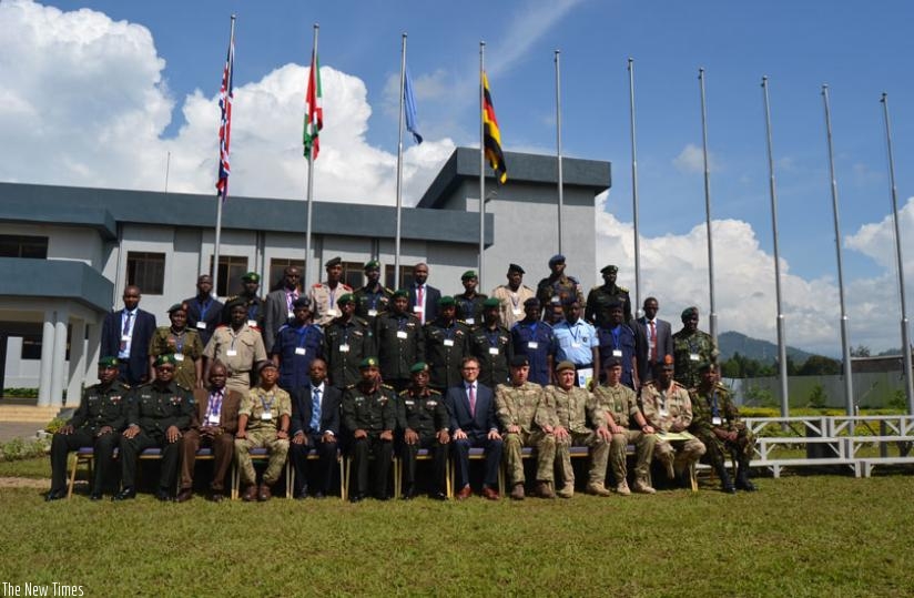 Officials and course participants in a group photo after the opening of the course. (Jean du2019Amour Mbonyinshuti)