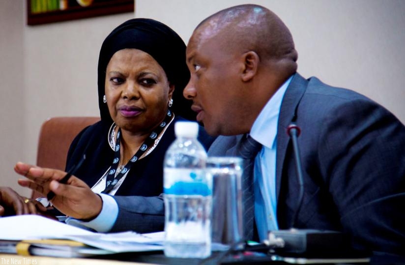 Rukia Shamte, the executive secretary of CCTTFA (L), and Peterson Mutabazi, an engineer in charge of transport at the Ministry of Infrastructure, exchange ideas during the Central Corridor stakeholders' meeting in Kigali yesterday. (Doreen Umutesi)