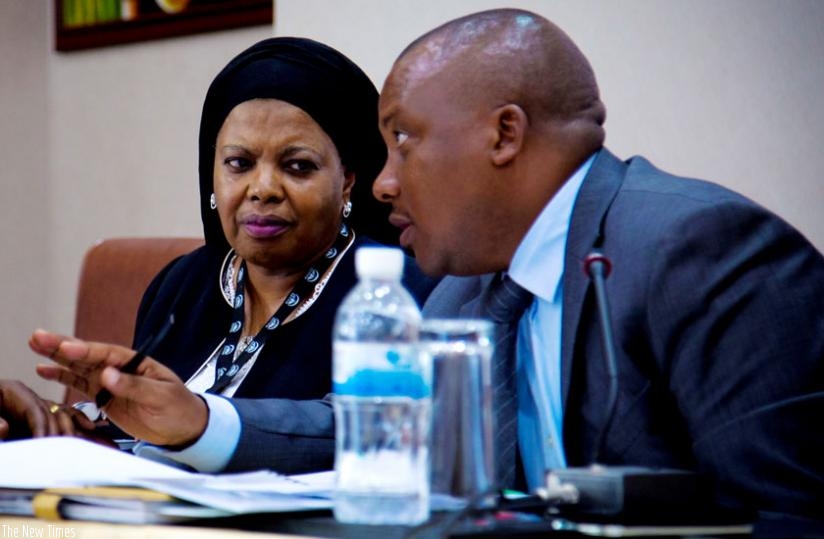 Rukia Shamte, the executive secretary of CCTTFA (L), and Peterson Mutabazi, an engineer in charge of transport at the Ministry of Infrastructure, exchange ideas during the Central Corridor stakeholders meeting in Kigali yesterday. (Doreen Umutesi)