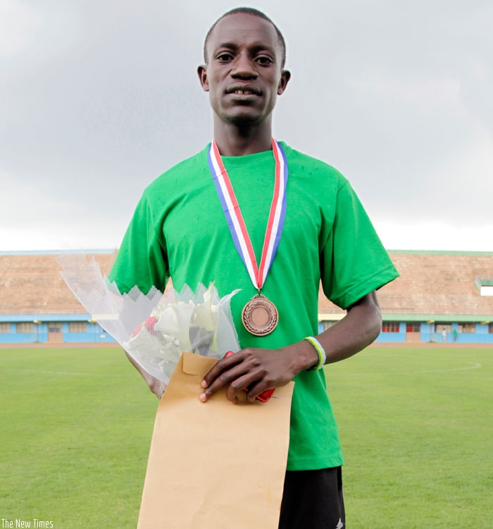 Robert Kajuga came in 3rd place in the 2012 Kigali Peace Marathon. The 28-year-old says more team work will make Rwandans win the coveted Kigali Peace Marathon. (File)