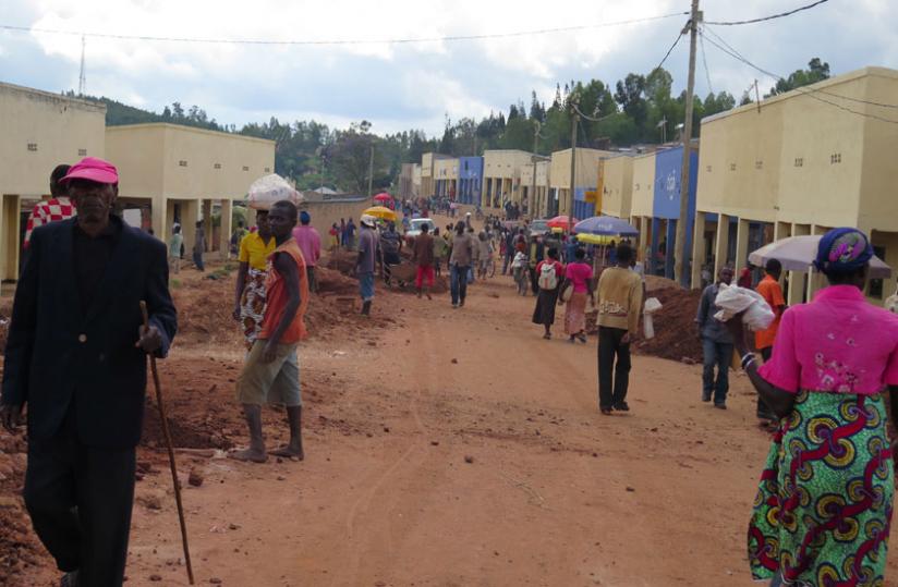 Locals at Musha trading centre, one of the areas set to benefit from the road. (Emmanuel Ntirenganya)