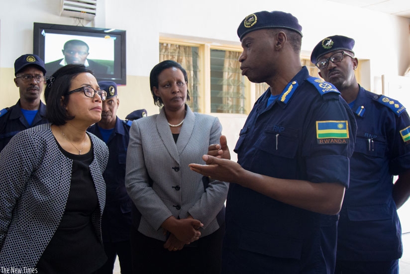  Indrawati (L)  and Gasinzigwa listen to Comissioner of Police Daniel Nyamwasa, the head of Kacyiru Police Hospital, yesterday. (Timothy Kisambira)