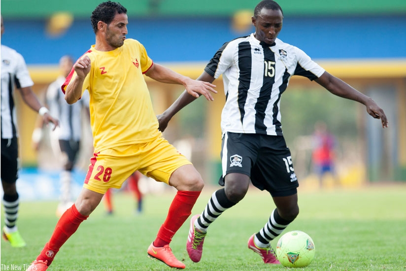 APR midfielder Andrew Buteera tries to sheild the ball from an Elemelik player in the final of the Cecafa Cup which the sudanese team won 1-0. (File)