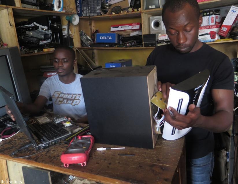 Bizwinumutima (left) and Mihigo at their Nyabugogo workshop. (Jean Nepo Ndikumana)