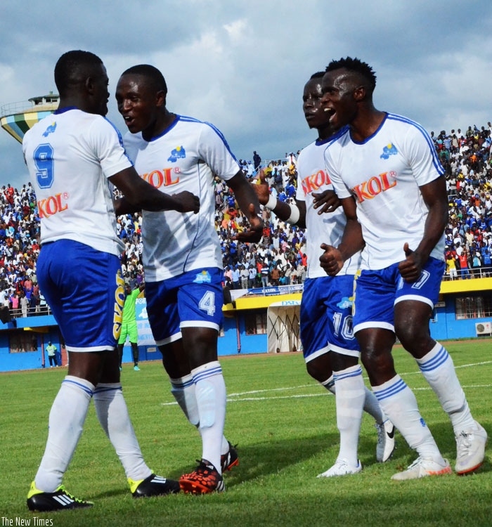 Rayon Sports striker Isaac Muganza (L) celebrates with team mates after scoring in a league game. The Blues  finished fifth after a turbulant season. (File)