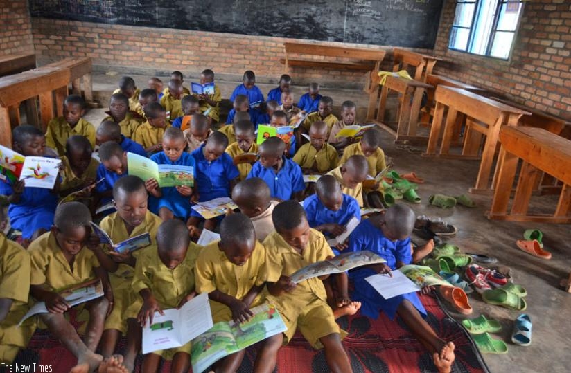 Pupils at Kirambo Primary school in Burera District read story books. (J.Mbonyinshuti)
