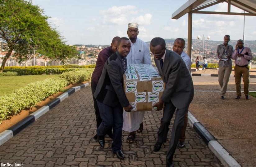 The youths upon arrival at Parliament Buildings where they delivered boxes full of individual petitions from over 250,000 youths from across the country. (Timothy Kisambira)