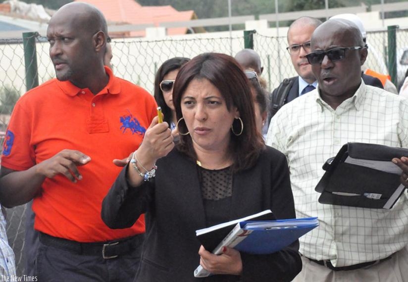 CAF Competitions Director Shereen Arafa (C), FERWAFA boss Vincent Nzamwita (L) and Gaspard Kaijuka (R), the LOC head of technic and competitions at the Ministry of Sports and Culture, touring Umuganda stadium in Rubavu on Monday. (Courtesy)