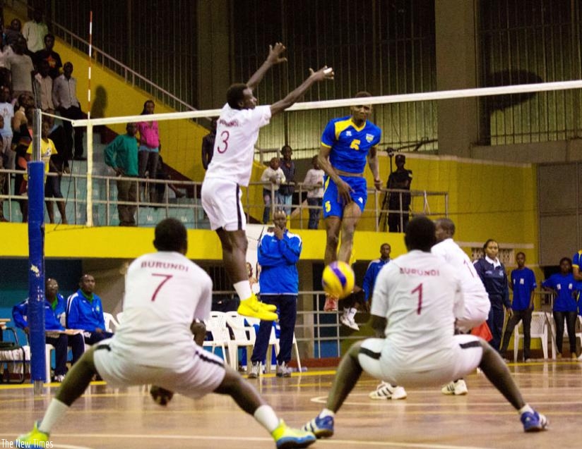Yves Mutabazi (right ) spike the ball against Burundi during Zone V Championships early this year. (T. Kisambira)