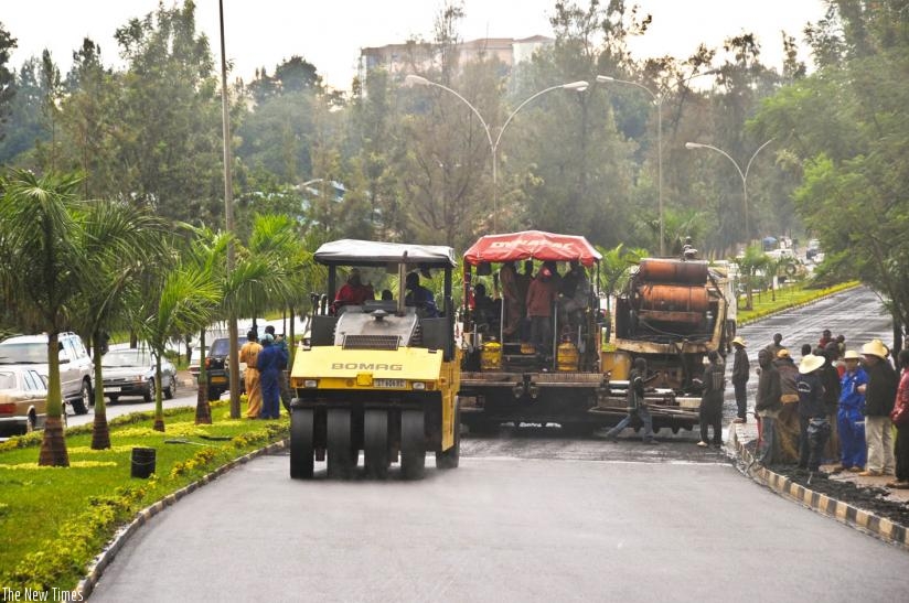 Contractors lay bitumen on Kigali International Airport road in 2009. (File)