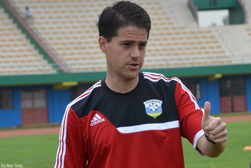 Johnny McKinstry applauds Amavubi players during a training session at Amahoro national stadium. (Sam Ngendahimana)