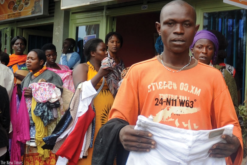 Street vendors at 'Kwa Rubangura' in Kigali. City authorities are working on an initiative where street vendors will be provided space to work in organised places effective next month. (File photo.)