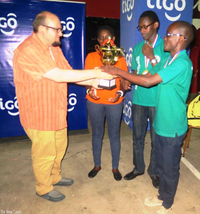 An IDebate official awards students from Liquidnet (Agohozo Shalom) in Kigali on Saturday. (S. Asaba)