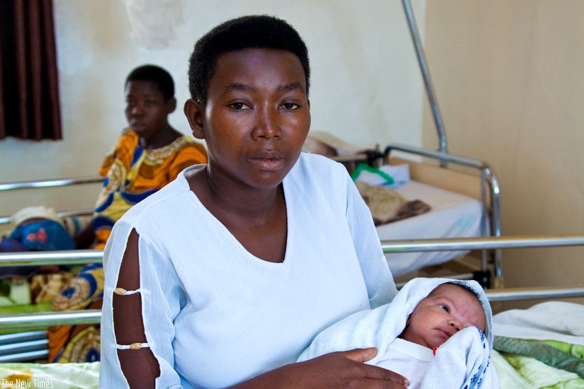 A mother at Matyazo Maternity Ward in Huye holds her newborn. (File)