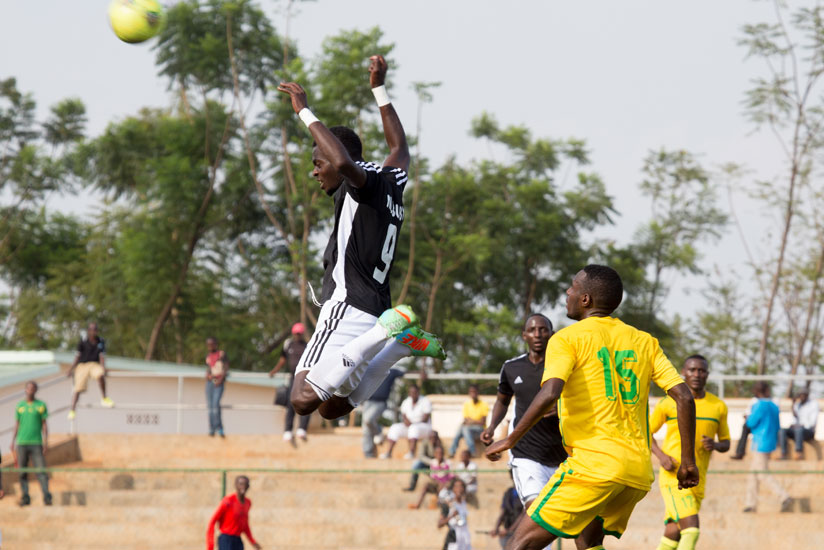 APR's Bernabe Mubumbyi jumps to head the ball away against AS Kigali earlier this season. (File photo) 