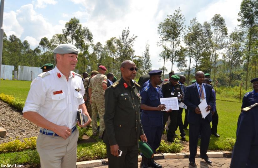 Col. Leakey (L) with Col. Rutaremara and other officials at the closure of the Civil-Military Cooperation Course in Musanze District. (Jean d'Amour Mboyinshuti)