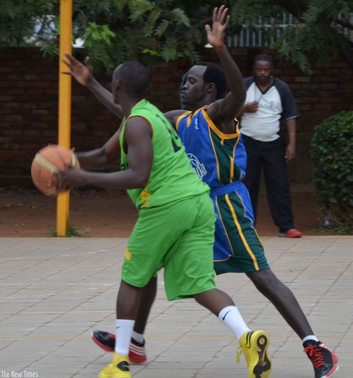 Patriots' point guard Patrick Habiyambere (R) guards Didier Gahorani of UGB earlier this season at KIST. (File)