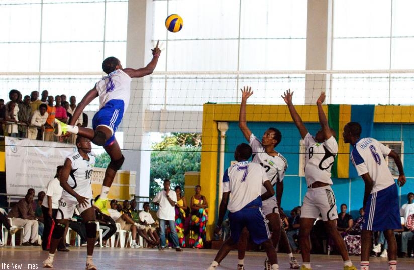 INATEK's Christophe Mukunzi (4) attempts to score against APR in last year's Genocide Memorial Tournament at Petit Stade. (File)