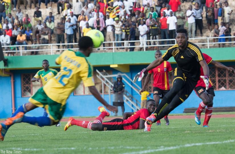 Dominique Savio Nshuti (L) scored Rwanda's lone goal in the first leg 2-1 loss to Uganda in Kigali last Saturday. (File)