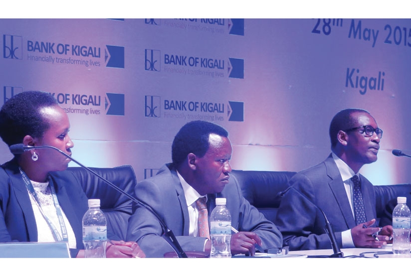 Bank of Kigali CEO James Gatera (right) speaks at the media briefing on Thursday as Shivon Byamukama, BK secretary and head of corporate affairs, and Daniel Ufitikirezi, a board member, look on. (Solomon Asaba)
