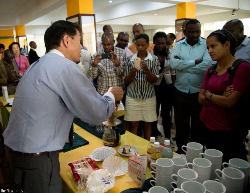 Jose Kawashima shows participants how to brew a variety of coffee from around the globe. (Doreen Umutesi)