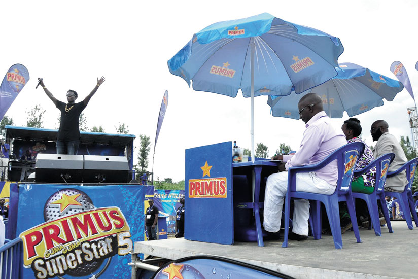 Bruce Melodie greets fans during his performance.