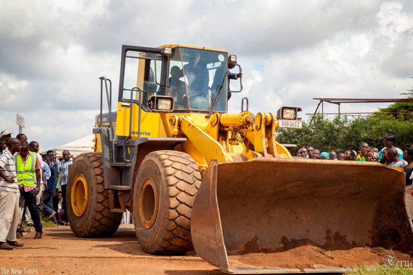 Mayor Ndamage (inside the cat) commissions the Busanza road construction yesterday. (Teddy Kamanzi)