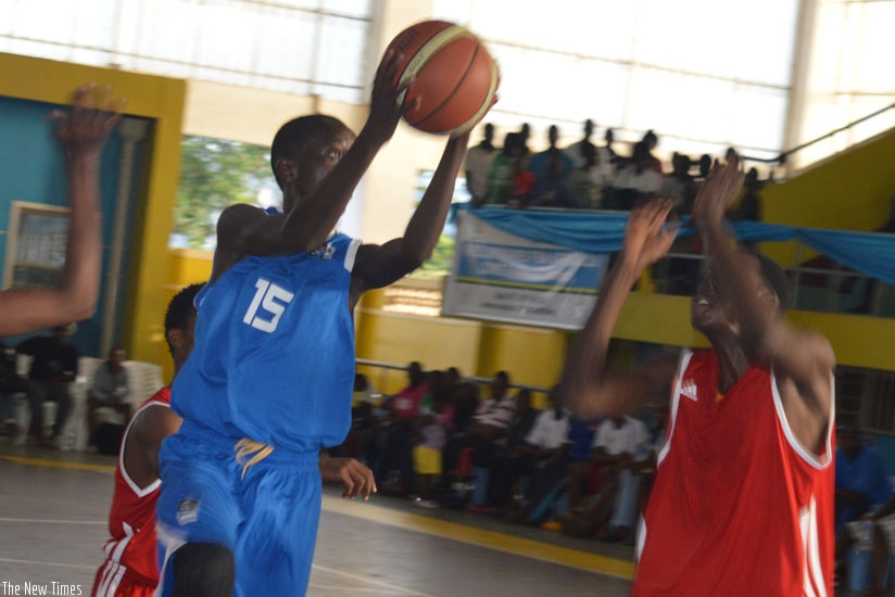 Sano Gasana grabs the ball during the second game against Ethiopia on Sunday. (Samuel Niyonziza)