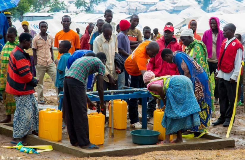 Burundian refugees at Mahama fetch water on Tuesday. (Doreen Umutesi)