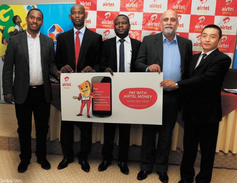 (L-R): WASAC chief James Sano, BNR's Karamuka, Stephen Waiswa, the head of Airtel Money, Bhullar and StarTimes CEO, Ados Wang pose for a photo after the launch of the drive. (Courtesy)