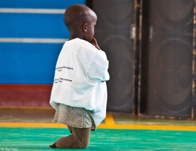 A disabled child at last yearu2019s International Day of People with Disabilities event, at Petit Stade in Remera, Kigali. (Timothy Kisambira)