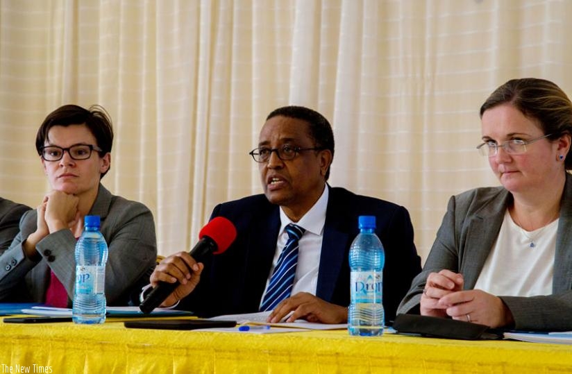 Prof. Lwakabamba (C) explains the progress of the education sector during a joint sector review in Kigali as Beaufils (L) and Skinner look on. (Doreen Umutesi)