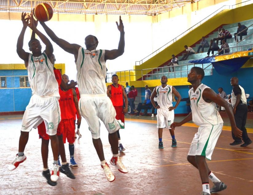 Espioir's forward Bienvenue Ngandu (C) grabs a rebound during a league game against CSK last season. CSK beat Espoir to win the local Genocide memorial tourney. (File photo)