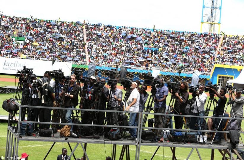 Local and foreign journalists cover the 20th commemoration of the 1994 Genocide against the Tutsi last year at Amahoro Stadium in Remera, Kigali. (Timothy Kisambira)