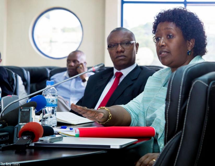 Dr Binagwaho (R) fields questions from journalists as Dr Patrick Ndimubanzi, the State Minister in charge of Public and Primary Health care, looks on during the news conference in Kigali on Wednesday. (D. Umutesi)