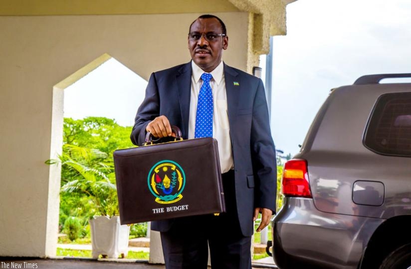 Finance and Economic Planning minister Claver Gatete arrives at Parliament to present the 2015/16 financial year Budget yesterday. (Timothy Kisambira)