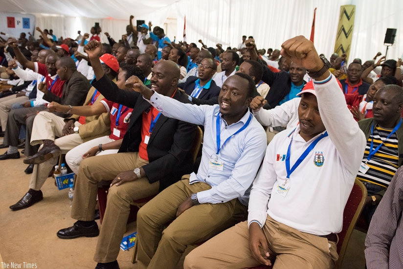 RPF cadres chant party slogans during yesterday's retreat at Rusororo, Kigali. President Kagame urged Rwandans to continue debate on term limits. (Village Urugwiro)