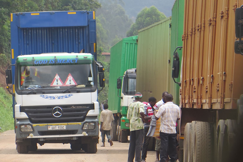 Kigali-bound cargo trucks wait for clearance at the Uganda/Rwanda border at Katuna. The recently signed deal to create Africa's largest free trade area will strengthen continent's economic integration. (Stephen Nuwagira)  