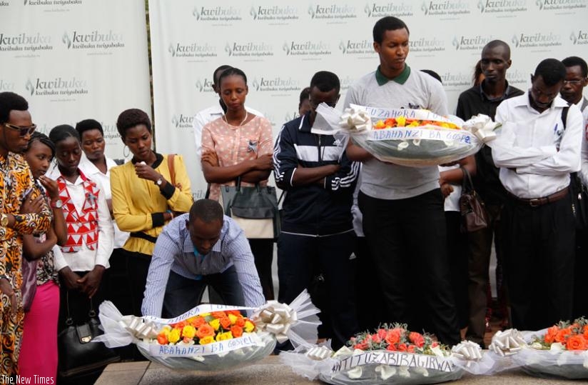 Participants lay wreaths on the mass grave at the Kigali Genocide Memorial Centre in Gisozi.