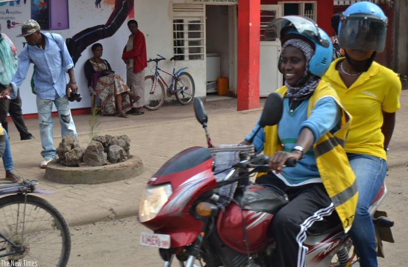 Ndacyayisenga carries a passenger in Musanze District last week. (J. Mbonyinshuti)