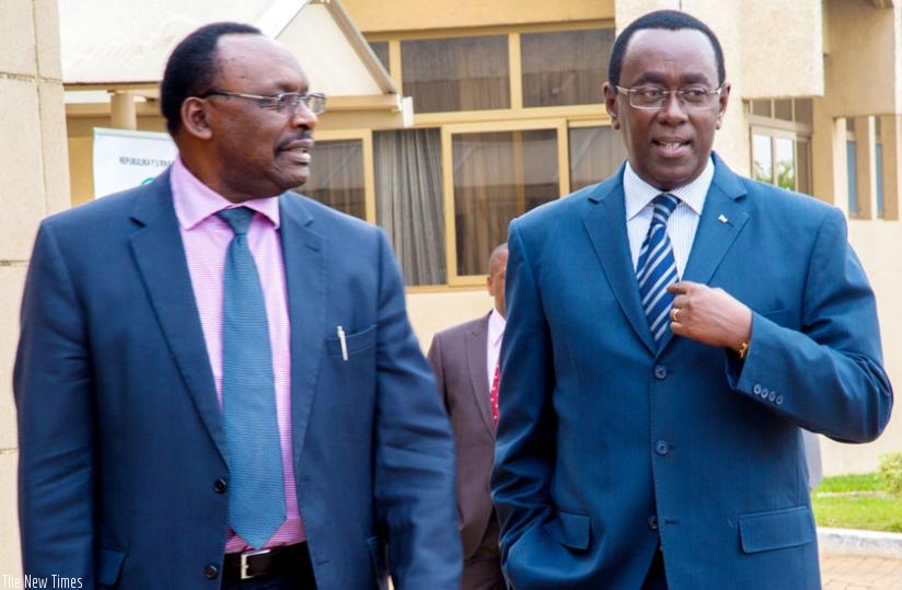 Senate president Bernard Makuza (R) interacts with Trade and Industry minister Francois Kanimba after a meeting in Parliament yesterday. (Doreen Umutesi)