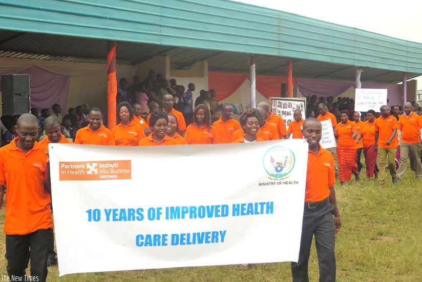 PIH staff march during the celebrations in Kayonza on Thursday. (S. Rwembeho)