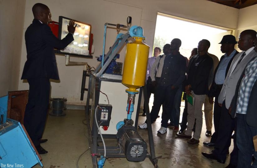 A Tumba College of Technology don explains to participants how demonstration of power plants work during the meeting last week. (Jean d'Amour Mbonyinshuti)
